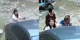 门前小车自动溜坡 女子路过用身体挡住