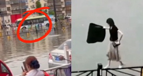 洛阳暴雨致路面积水女子穿拖鞋走在护栏上引人围观