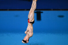 中国选手谢思埸卫冕奥运会跳水男子3米板