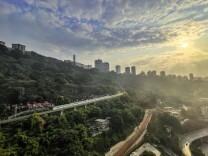 Chongqing's 'Train to Spring' returns as monorail glides through blossoms