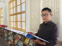 覃仕国：扎根山乡三十四载的山村“大先生”