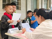 石门太平镇完小：家长学生同执考 诗词传韵共成长