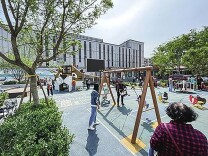 《中国建设报》——让孩子在“家门口”健康快乐成长